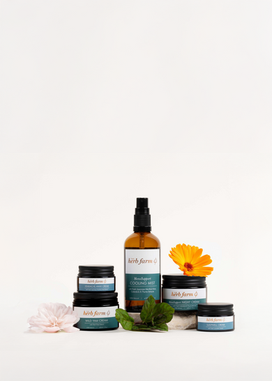 Menopause Support Product Lineup with flowers and herbs. 
